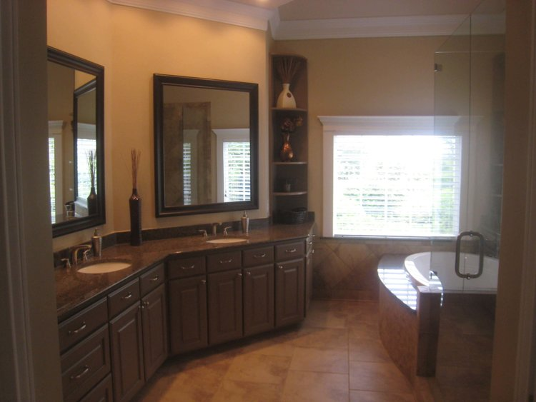 Elegant bathroom with double sinks on a dark wood vanity.