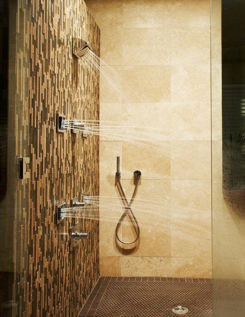 Sleek modern shower with glass doors, minimalist fixtures, and elegant tilework.