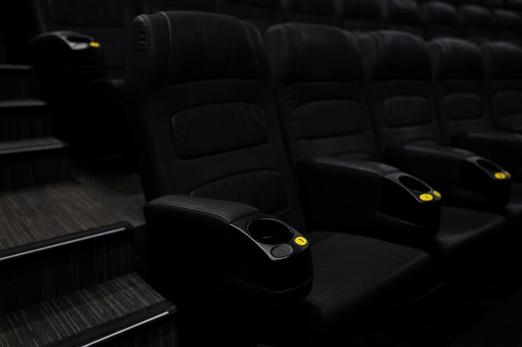 Home theatre seating with armrests and built-in cup holders for added convenience.