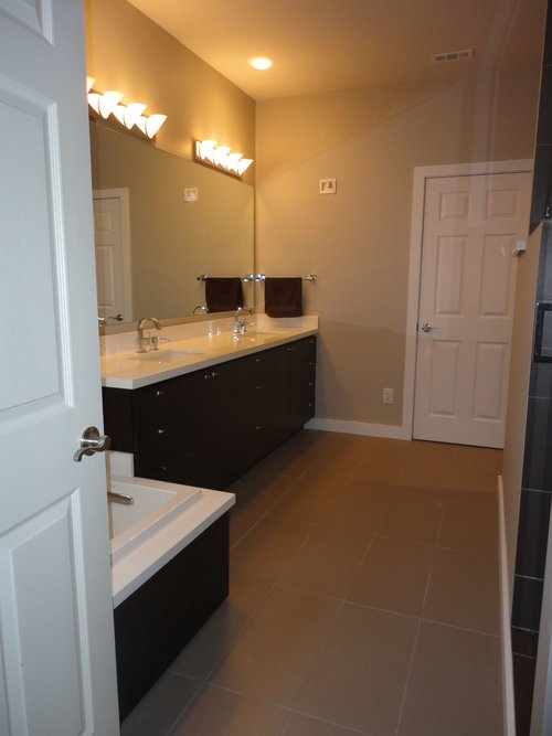 Custom bathroom remodel featuring a sleek wall-mounted vanity.