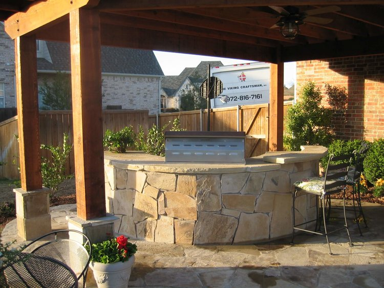 An outdoor space with a grill